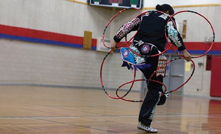 A student doing a hoop dance