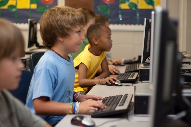 Children working in a computer lab