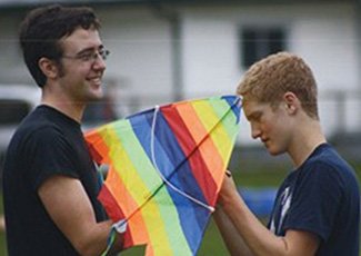 2 students holding a kite