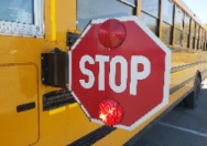 School bus with stop arm out