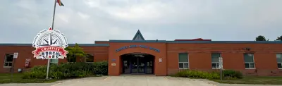 exterior picture of Courtice North Public School and their logo