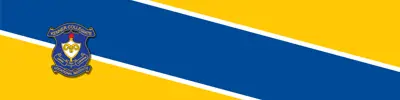yellow and blue striped banner with Kenner Intermediate School logo