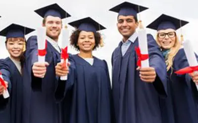 Graduating students with diplomas