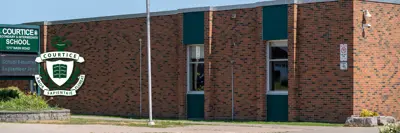 exterior picture of Courtice Secondary School and the school logo
