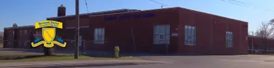 exterior picture of Norwood Intermediate School and their logo