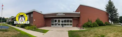 exterior picture of Hampton Junior Public School and their logo