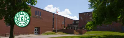 exterior picture of Adam Scott with school logo