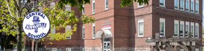 exterior picture of Central Public School with their logo