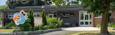exterior picture of Keith Wightman Public School and their logo