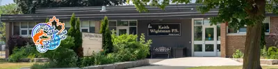 exterior picture of Keith Wightman Public School and their logo