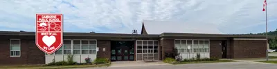 exterior picture of Camborne Public School and their logo