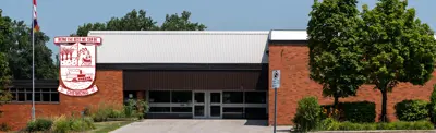 exterior picture of Chemong Public School and their logo