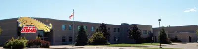 exterior picture of John M. James Public School and their logo