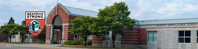 exterior picture of Beatrice Strong Public School and their logo