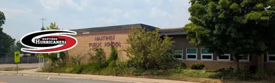 exterior picture of Hastings Public School and their logo