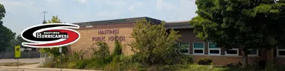 exterior picture of Hastings Public School and their logo