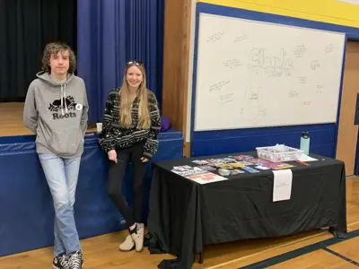 students standing in front of information booth