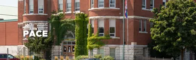 PACE logo on background picture of the school