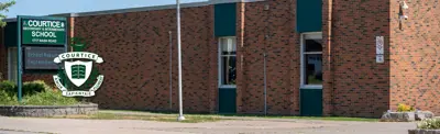 exterior picture of Courtice Intermediate School and their logo