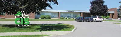 CIS Clarington Logo on background image of school