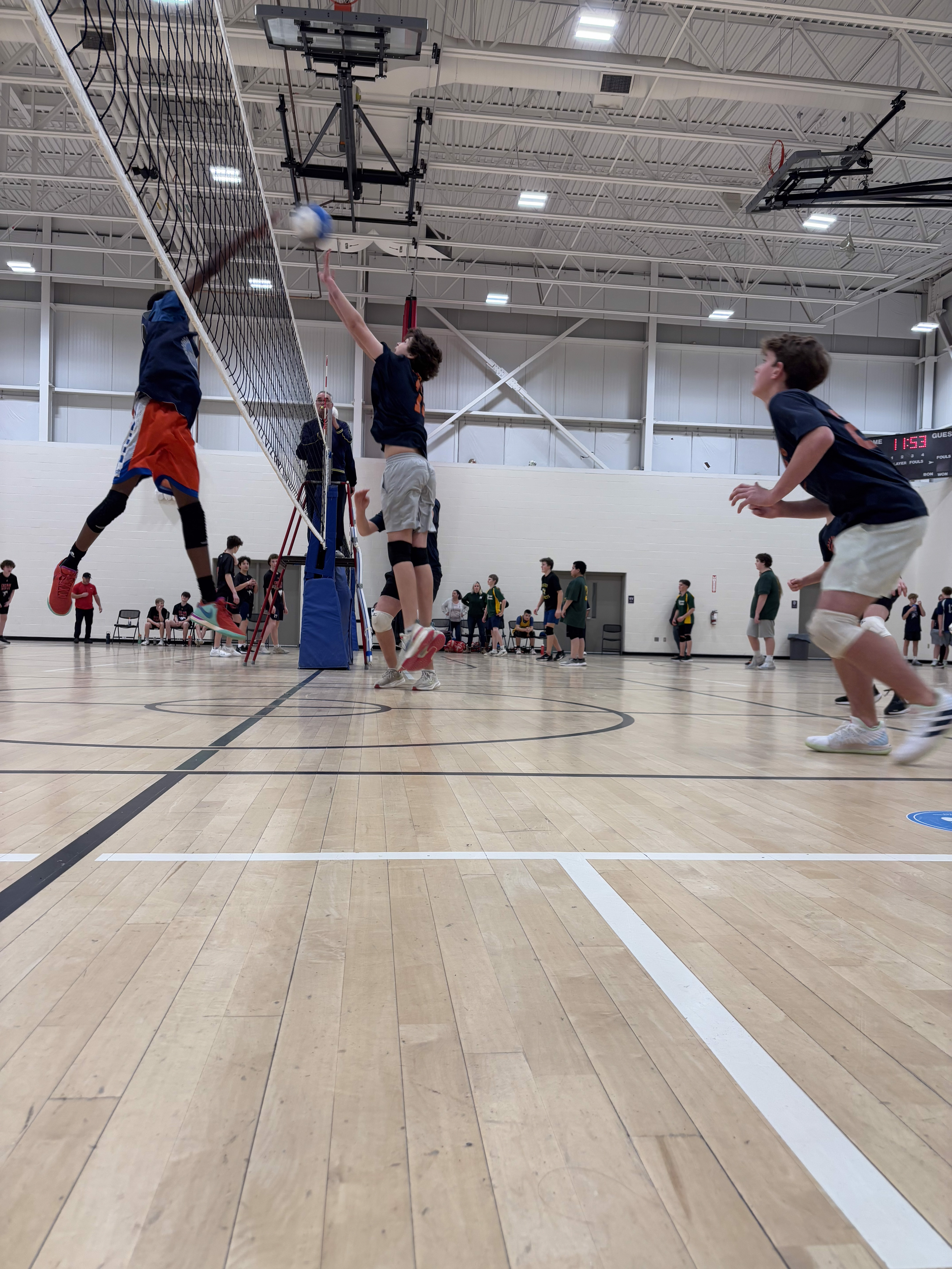students playing volleyball