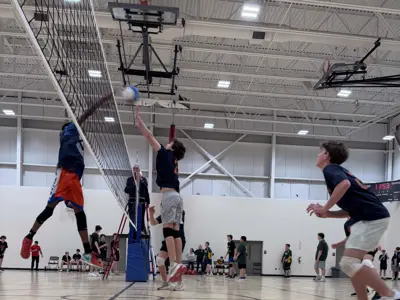 students playing volleyball