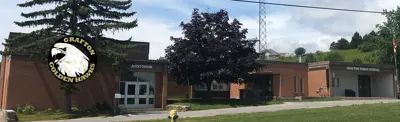 exterior picture of Grafton Public School and their logo
