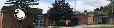 exterior picture of Grafton Public School and their logo