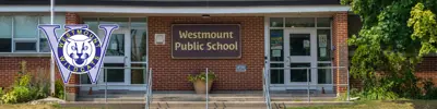 exterior picture of Westmount Public School and their logo